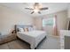 Main bedroom with a king-size bed and ceiling fan at 3724 15Th Se Ave, Largo, FL 33771