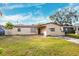 Ranch style home with a large front yard at 3724 15Th Se Ave, Largo, FL 33771