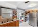 Kitchen with wood cabinets, stainless steel appliances and pantry at 3724 15Th Se Ave, Largo, FL 33771