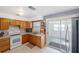 Kitchen with wood cabinets, and view to a Florida room at 3724 15Th Se Ave, Largo, FL 33771