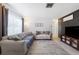 Living room featuring sectional sofa and a brick accent wall at 3724 15Th Se Ave, Largo, FL 33771
