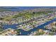 Bird's-eye view of waterfront community with many homes and canals at 4514 Dewey Dr, New Port Richey, FL 34652
