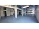 Unfinished basement area with light grey flooring at 4514 Dewey Dr, New Port Richey, FL 34652