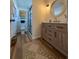 Updated bathroom with stylish vanity, new flooring, and a walk-in shower at 4514 Dewey Dr, New Port Richey, FL 34652