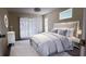 Spacious bedroom with a plush bed and sliding glass doors at 4514 Dewey Dr, New Port Richey, FL 34652