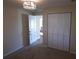 Well-lit bedroom with ample closet space and carpet flooring at 4514 Dewey Dr, New Port Richey, FL 34652