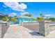Bright blue community building with a patio and parking lot at 4514 Dewey Dr, New Port Richey, FL 34652