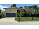 Attractive single-story home with a two-car garage and landscaped yard at 4514 Dewey Dr, New Port Richey, FL 34652
