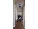 Bright hallway with wood floors and decorative accents at 4514 Dewey Dr, New Port Richey, FL 34652