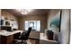 Bright home office featuring built-in shelving and large window at 4514 Dewey Dr, New Port Richey, FL 34652