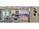 Modern kitchen with white cabinets, island, and stainless steel appliances at 4514 Dewey Dr, New Port Richey, FL 34652