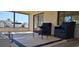 Relaxing screened patio furnished with wicker chairs at 4514 Dewey Dr, New Port Richey, FL 34652