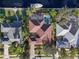 Aerial view showing home's layout, pool, and canal-side location at 4531 Swordfish Dr, Bradenton, FL 34208