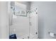Shower with glass enclosure and blue tile accents at 4531 Swordfish Dr, Bradenton, FL 34208