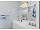 Clean bathroom with white vanity and walk-in shower at 4531 Swordfish Dr, Bradenton, FL 34208