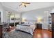 Main bedroom with wood floors, sliding doors to lanai, and ensuite bath at 4531 Swordfish Dr, Bradenton, FL 34208