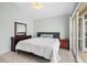 Comfortable bedroom with a king-size bed and access to a patio at 4531 Swordfish Dr, Bradenton, FL 34208