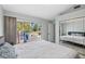 Bright bedroom with king-size bed and sliding doors to backyard at 4531 Swordfish Dr, Bradenton, FL 34208