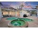 Inviting pool and spa area with covered patio and outdoor lighting at 4531 Swordfish Dr, Bradenton, FL 34208