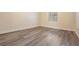 Bright bedroom with wood-look floors and a window at 5221 Bayshore Blvd # 37, Tampa, FL 33611