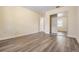 Spacious bedroom featuring wood-look floors and mirrored closet doors at 5221 Bayshore Blvd # 37, Tampa, FL 33611