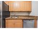 Kitchen boasts granite countertops and ample wood cabinetry at 5221 Bayshore Blvd # 37, Tampa, FL 33611
