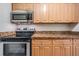Stainless steel appliances and wood cabinets in this kitchen at 5221 Bayshore Blvd # 37, Tampa, FL 33611