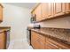 Efficient kitchen featuring granite countertops and wood cabinets at 5221 Bayshore Blvd # 37, Tampa, FL 33611