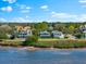 Aerial view of waterfront homes and neighborhood at 555 Gulf Dr, Crystal Beach, FL 34681