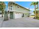 Attached garage with exterior stairs at 555 Gulf Dr, Crystal Beach, FL 34681