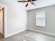 Spacious bedroom with wood-look floors and a window at 5918 N Eustace Ave, Tampa, FL 33604