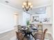 Dining area with a round table, modern chairs, and chandelier at 5918 N Eustace Ave, Tampa, FL 33604