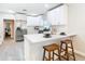 Modern white kitchen with stainless steel appliances at 5918 N Eustace Ave, Tampa, FL 33604