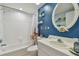 Bathroom with single vanity, shower, and starfish decor at 6450 Shoreline Dr # 9502, St Petersburg, FL 33708