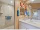 Walk-in shower, single vanity, and tiled walls at 6450 Shoreline Dr # 9502, St Petersburg, FL 33708
