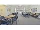 Relaxing community room with tables and seating at 6450 Shoreline Dr # 9502, St Petersburg, FL 33708