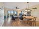 Combined living and dining area with hardwood floors and balcony access at 6450 Shoreline Dr # 9502, St Petersburg, FL 33708