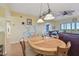 Charming dining area with tile-top table and hardwood floors at 6450 Shoreline Dr # 9502, St Petersburg, FL 33708