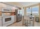 Modern kitchen with stainless steel appliances and breakfast nook at 6450 Shoreline Dr # 9502, St Petersburg, FL 33708