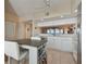 Efficient kitchen with white cabinetry, breakfast bar, and water views at 6450 Shoreline Dr # 9502, St Petersburg, FL 33708