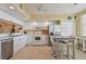 Well-equipped kitchen featuring stainless steel appliances and breakfast bar at 6450 Shoreline Dr # 9502, St Petersburg, FL 33708