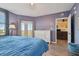 Main bedroom with king bed, dresser, and access to balcony at 6450 Shoreline Dr # 9502, St Petersburg, FL 33708
