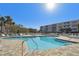 Inviting community pool with ample lounge chairs at 6450 Shoreline Dr # 9502, St Petersburg, FL 33708