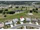 Aerial view of house and surrounding golf course community at 676 Allegheny Dr, Sun City Center, FL 33573