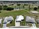 Aerial view showcasing home's location in a golf course community at 676 Allegheny Dr, Sun City Center, FL 33573