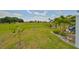 Landscaped backyard with golf course view at 676 Allegheny Dr, Sun City Center, FL 33573