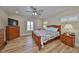 Bright bedroom with wood flooring and built-in wooden dresser at 676 Allegheny Dr, Sun City Center, FL 33573