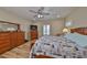 Comfortable bedroom with wood flooring and ample storage at 676 Allegheny Dr, Sun City Center, FL 33573