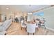 Charming dining room with a round table, four chairs, and kitchen view at 676 Allegheny Dr, Sun City Center, FL 33573