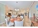 Open concept dining room adjacent to kitchen, featuring a wooden table at 676 Allegheny Dr, Sun City Center, FL 33573
